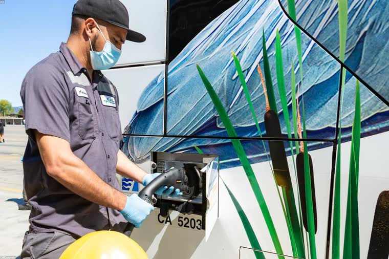 Electrician installing a Level 2 EV charger